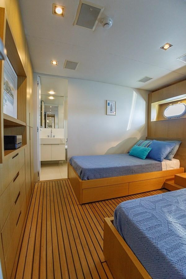a bedroom with two beds aboard PAPA-GOLFE Yacht for Sale