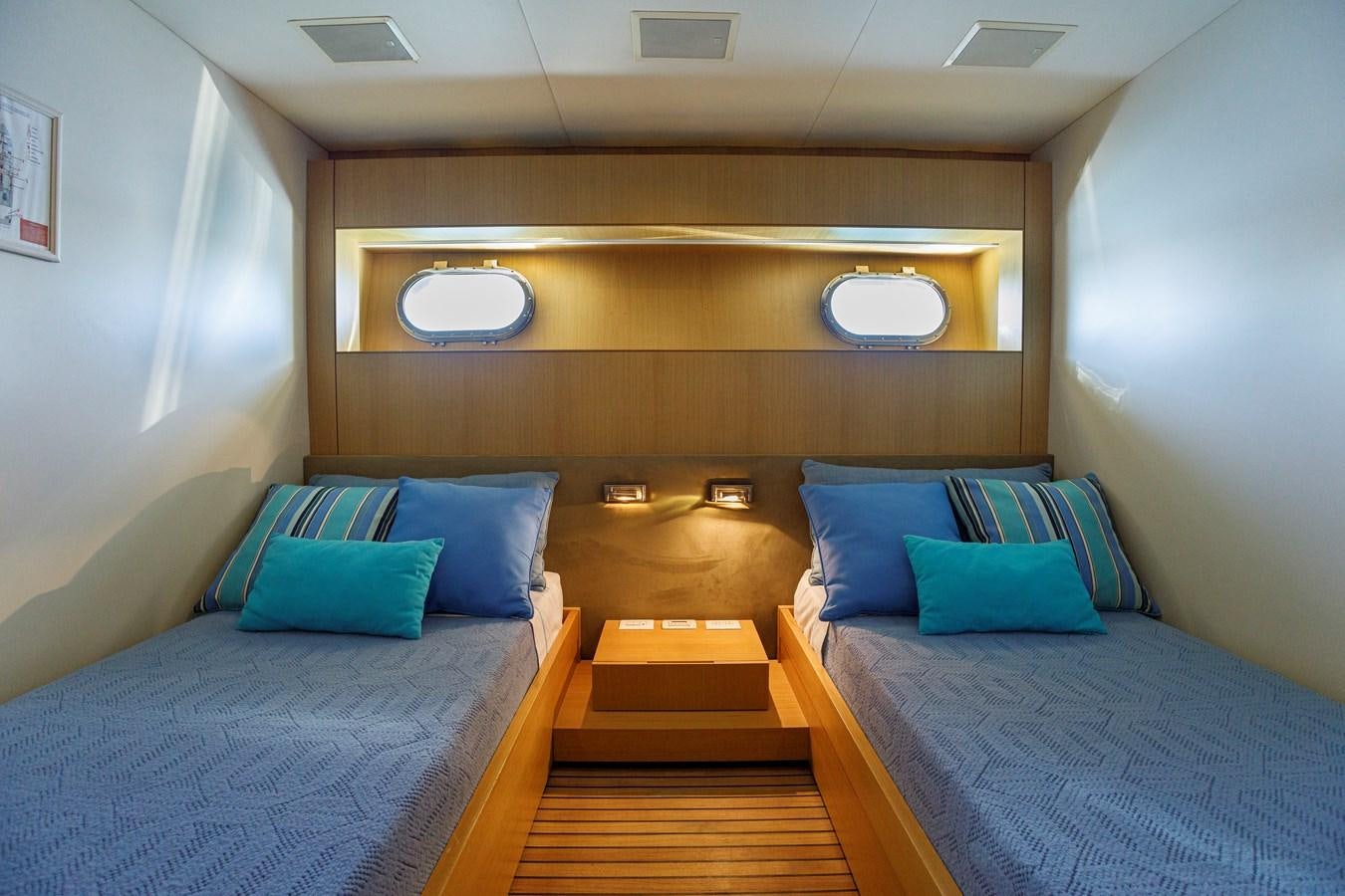 a room with two beds aboard PAPA-GOLFE Yacht for Sale