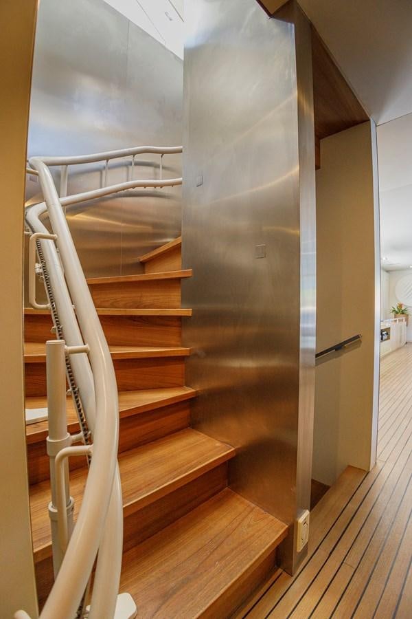 a wooden staircase in a house aboard PAPA-GOLFE Yacht for Sale
