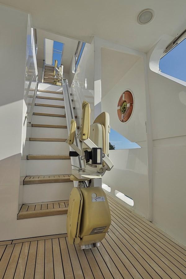 a staircase in a room aboard PAPA-GOLFE Yacht for Sale