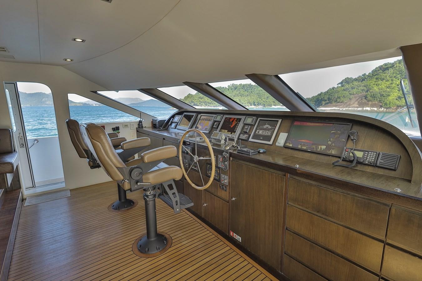 a wooden desk with a computer on it aboard PAPA-GOLFE Yacht for Sale