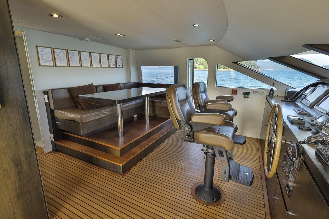 a room with a couch and a tv aboard PAPA-GOLFE Yacht for Sale