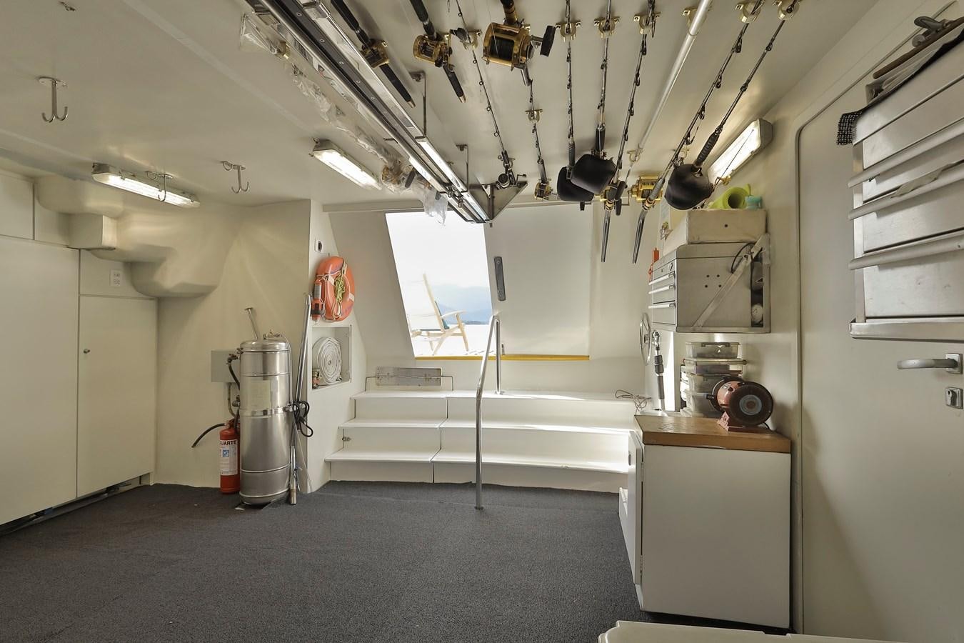 a kitchen with white cabinets aboard PAPA-GOLFE Yacht for Sale