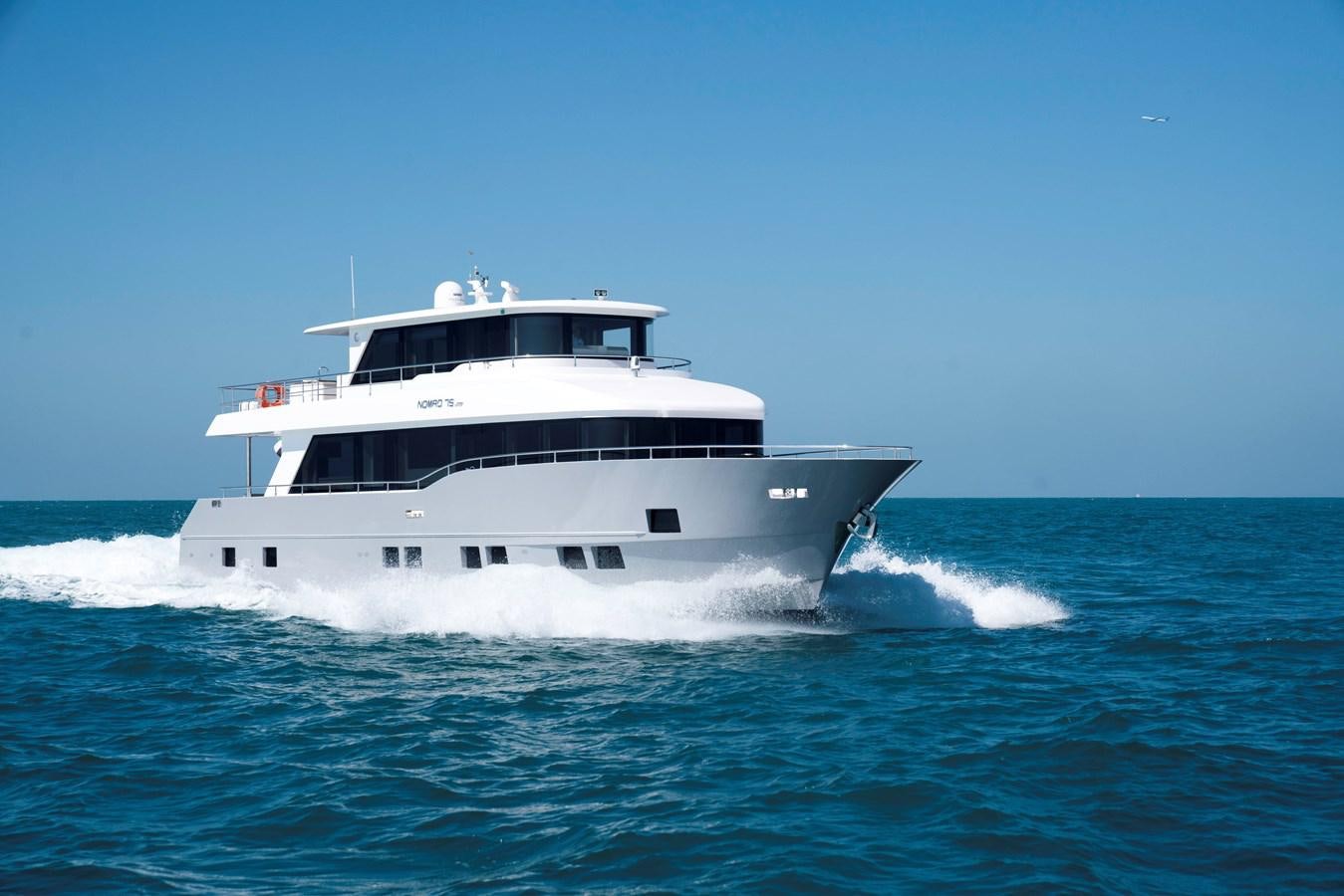 a boat on the water aboard NOMAD 70 SUV Yacht for Sale