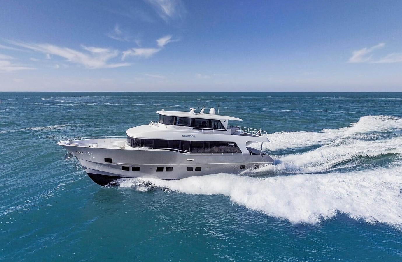 a boat in the water aboard NOMAD 70 SUV Yacht for Sale