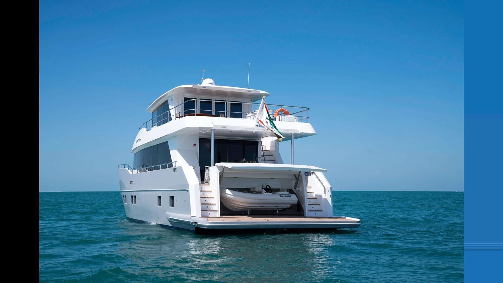 a boat in the water aboard NOMAD 70 SUV Yacht for Sale