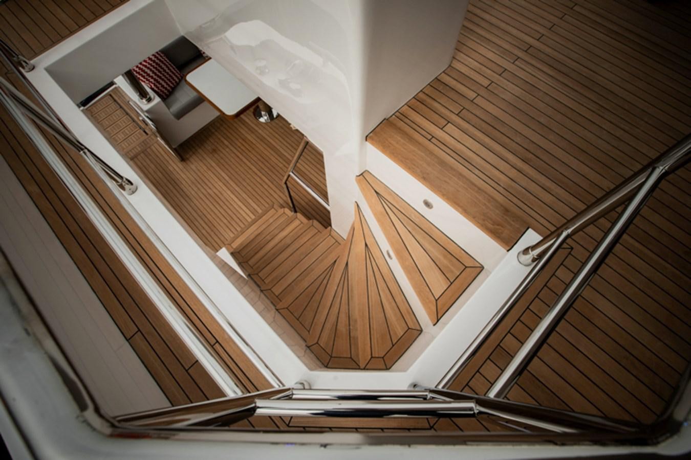 looking down at a staircase aboard NOMAD 70 SUV Yacht for Sale