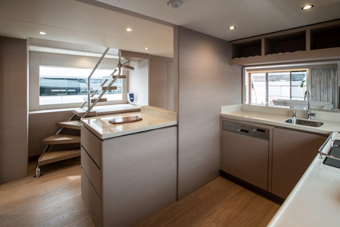 a kitchen with a ladder aboard NOMAD 70 SUV Yacht for Sale