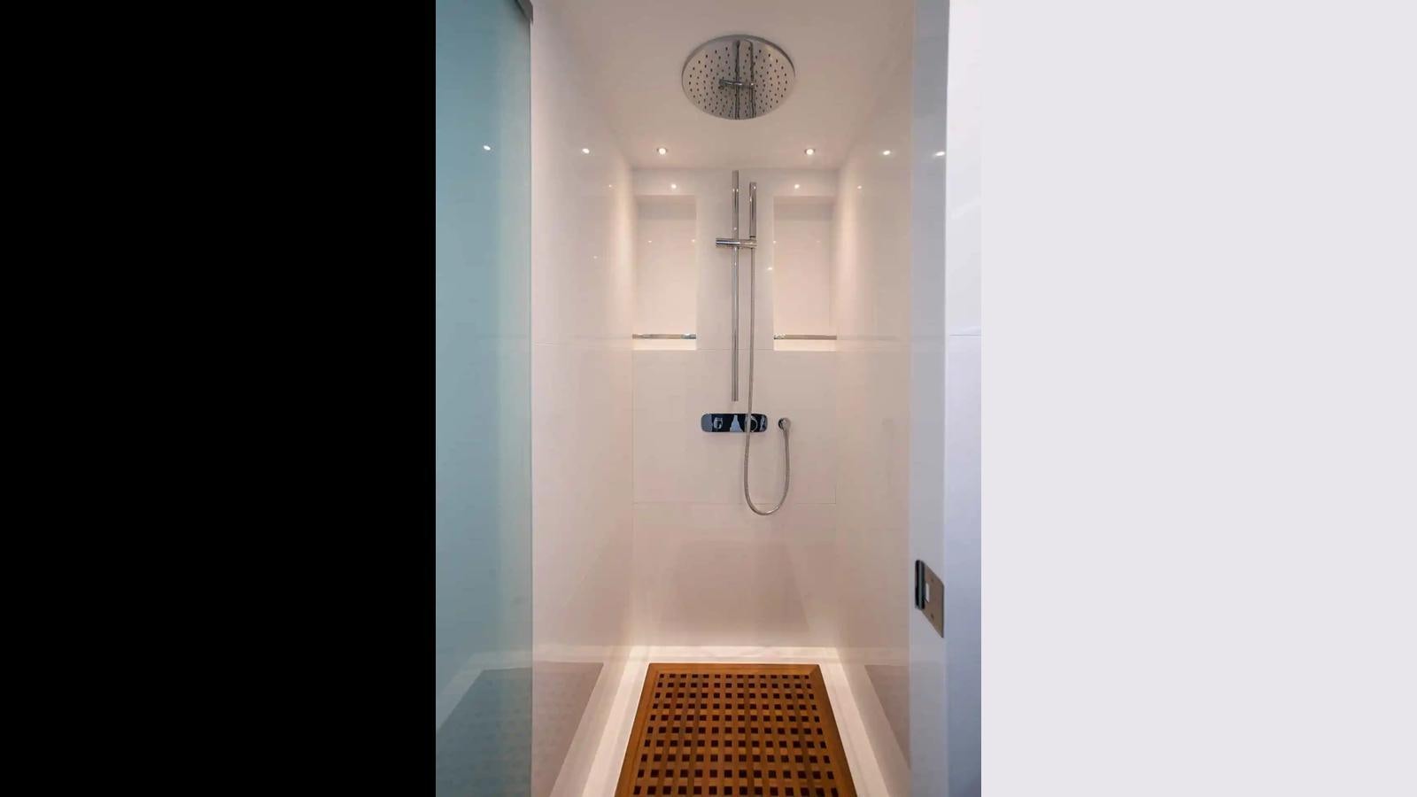 a bathroom with a shower aboard NOMAD 70 SUV Yacht for Sale
