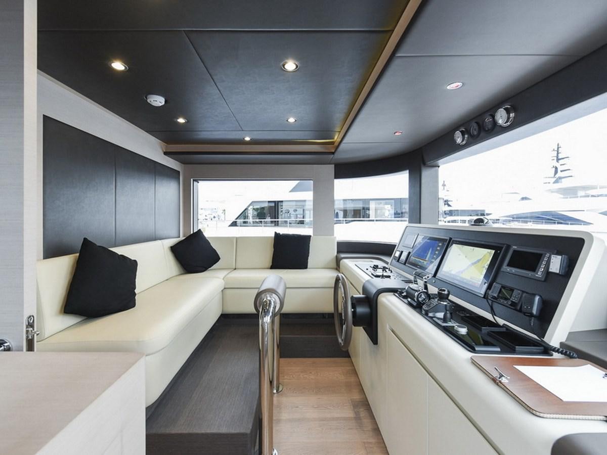 a room with a bed and a desk aboard NOMAD 70 SUV Yacht for Sale