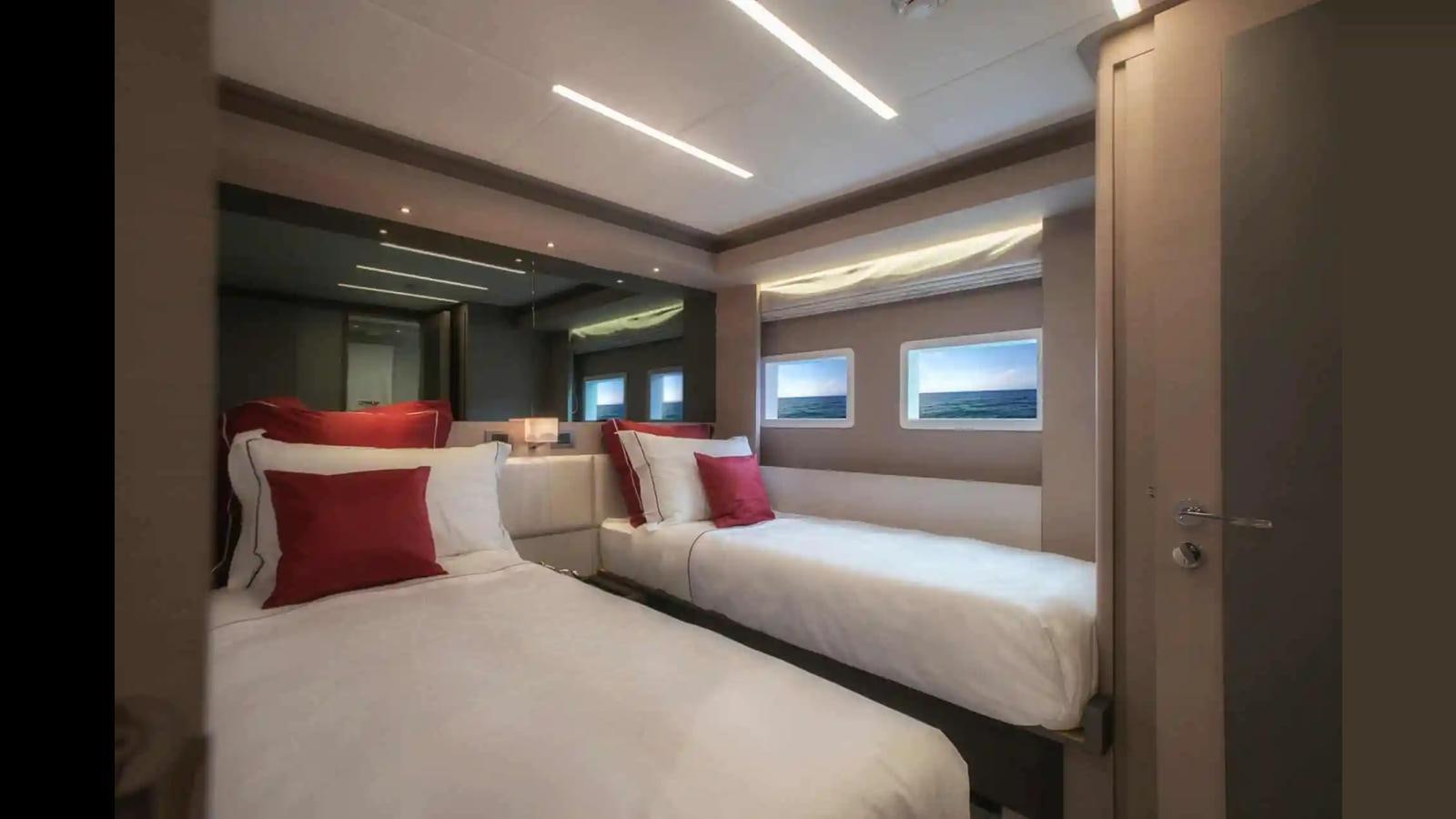 a room with two beds aboard NOMAD 70 SUV Yacht for Sale
