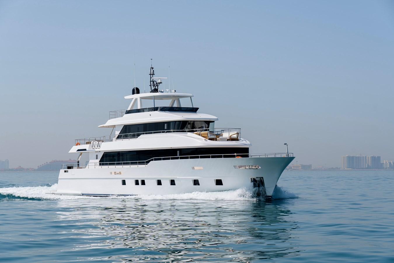 a white yacht in the water aboard NOMAD 101 Yacht for Sale