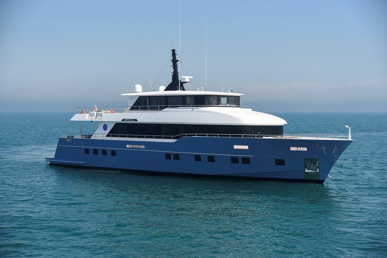 a large boat in the water aboard NOMAD 95 SUV Yacht for Sale