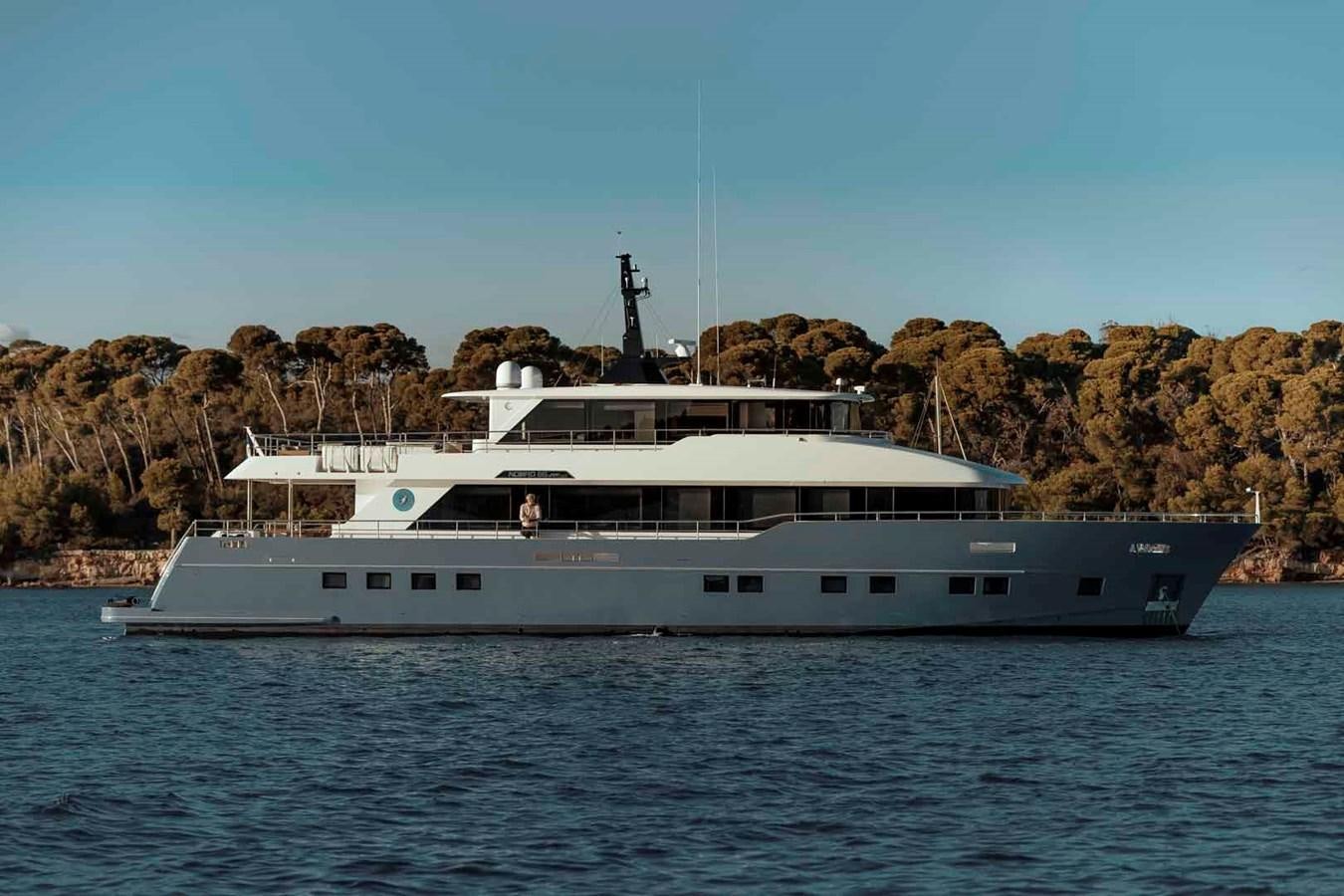 a large white yacht aboard NOMAD 95 SUV Yacht for Sale