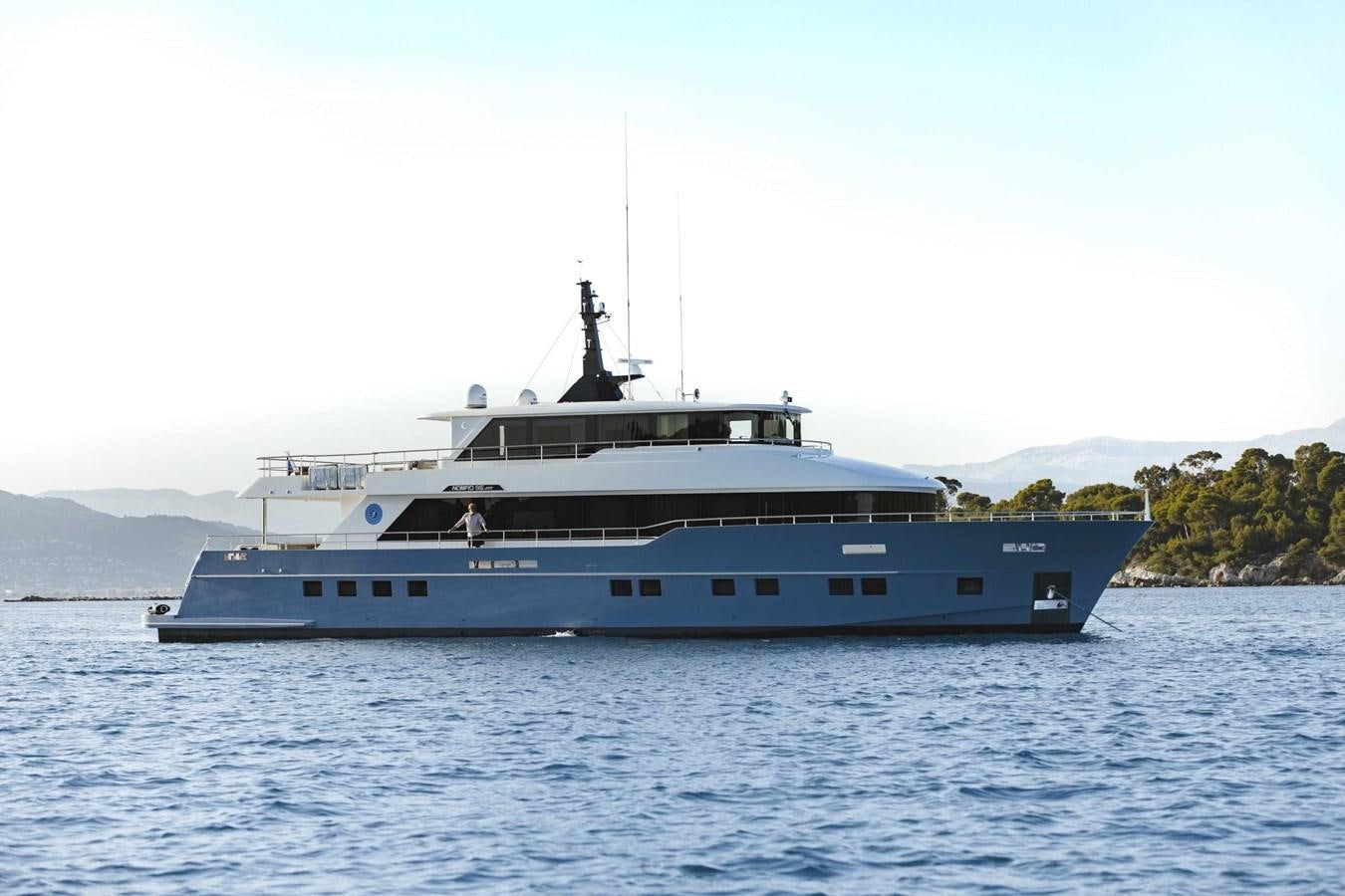 a large boat in the water aboard NOMAD 95 SUV Yacht for Sale