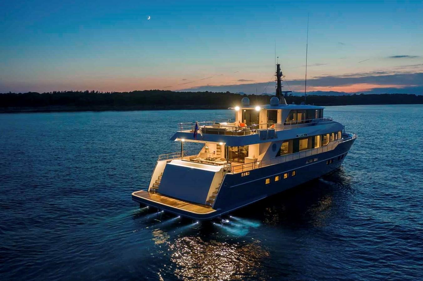 a boat on the water aboard NOMAD 95 SUV Yacht for Sale