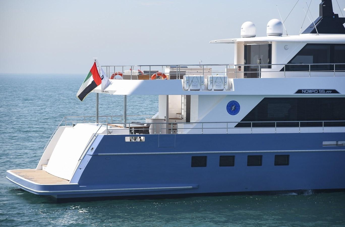 a large boat in the water aboard NOMAD 95 SUV Yacht for Sale
