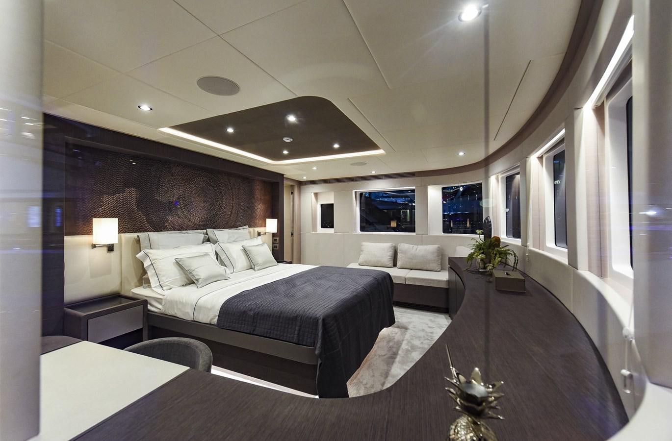 a large bedroom with a large bed aboard NOMAD 95 SUV Yacht for Sale