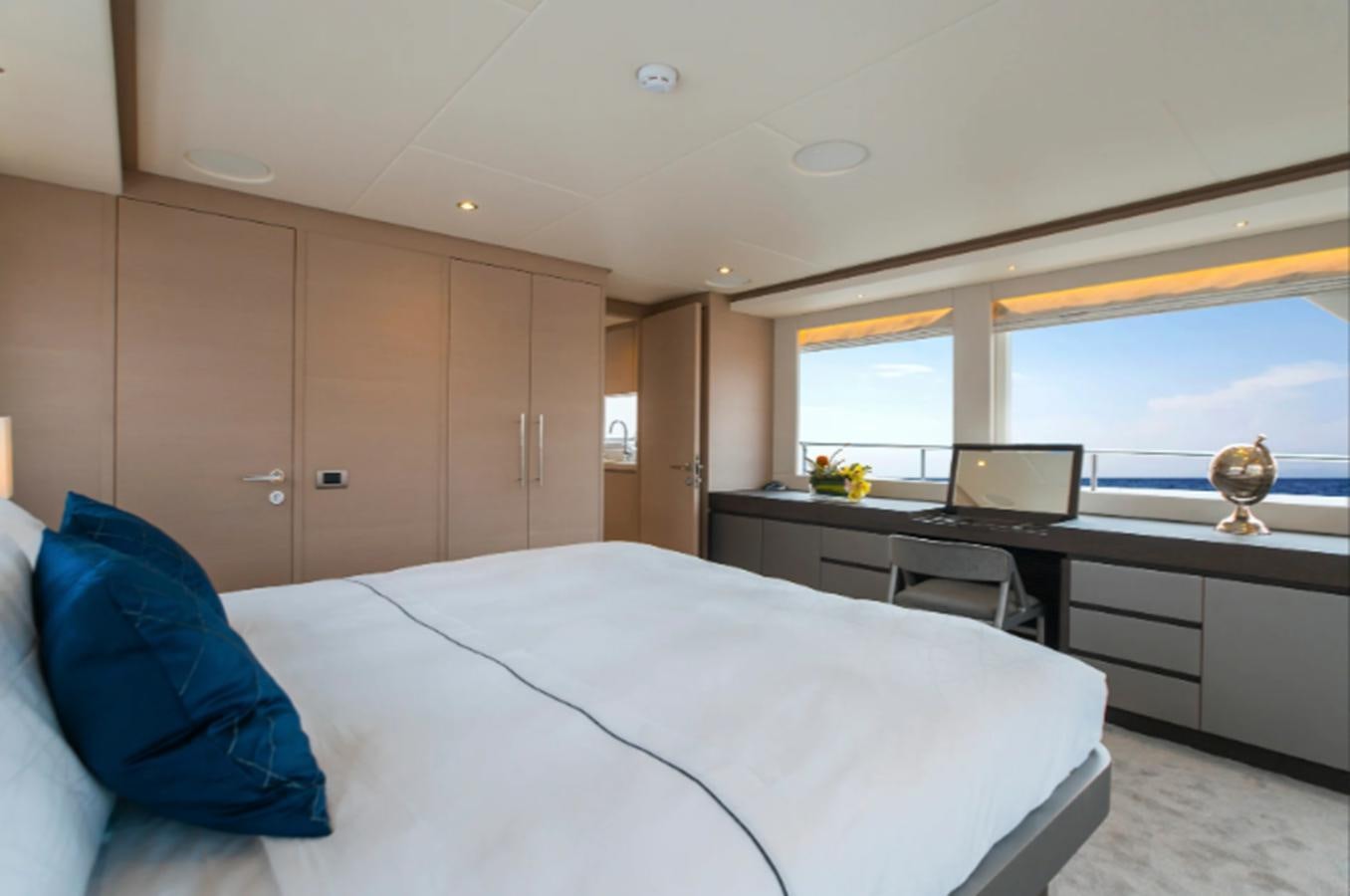 a bedroom with a large bed aboard NOMAD 95 SUV Yacht for Sale