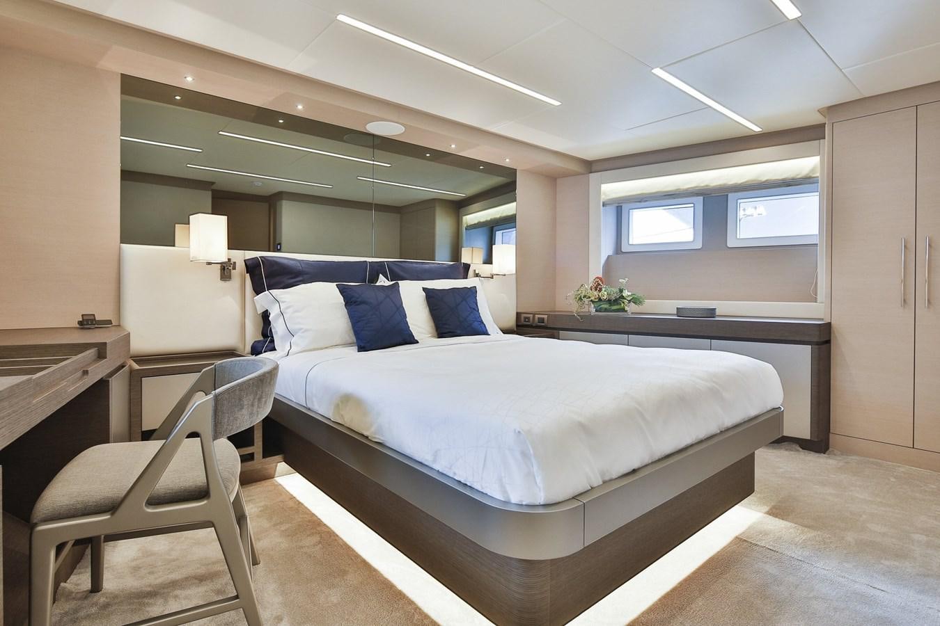 a bed in a room aboard NOMAD 95 SUV Yacht for Sale