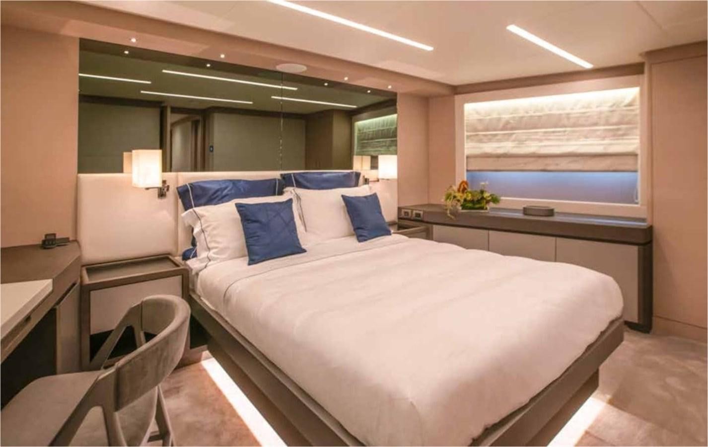a bed with a white sheet aboard NOMAD 95 SUV Yacht for Sale