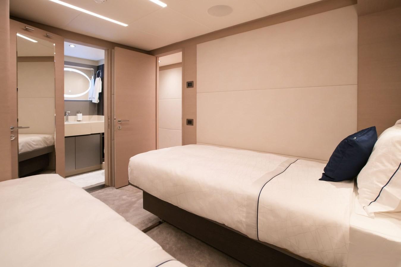 a hotel room with a bed aboard NOMAD 95 SUV Yacht for Sale