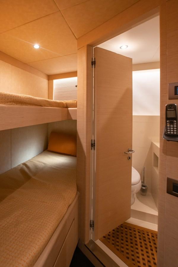 a bathroom with a toilet and a sink aboard NOMAD 95 SUV Yacht for Sale