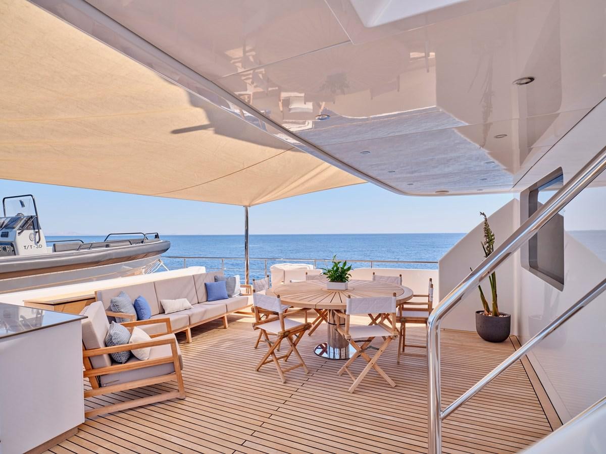 a room with a table and chairs aboard 3D Yacht for Sale