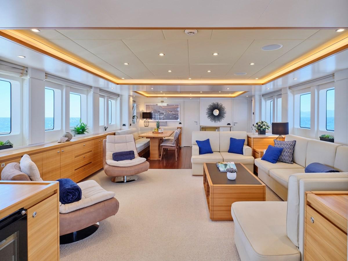 a living room with a couch and a table aboard 3D Yacht for Sale