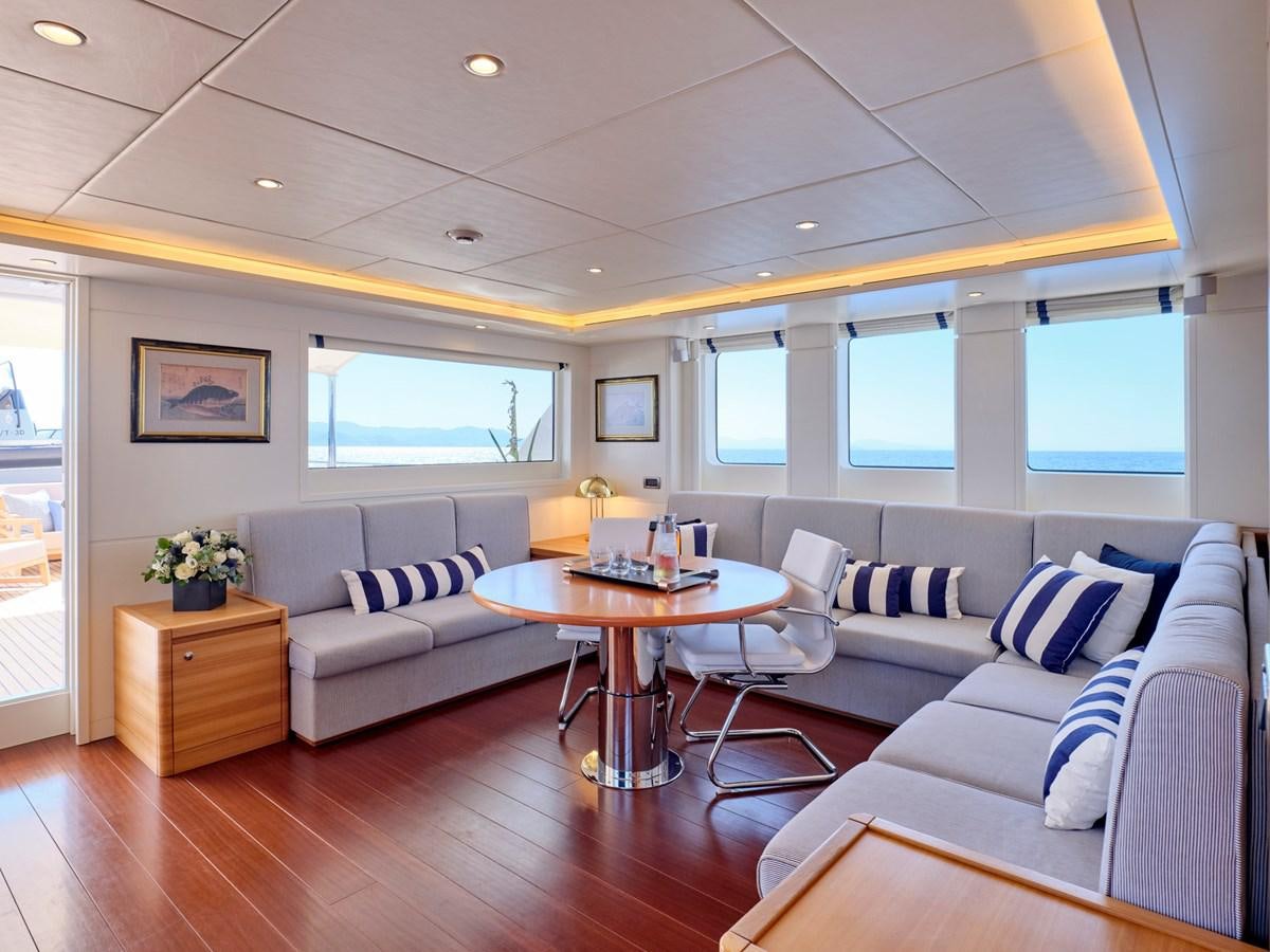 a living room with a couch and a table aboard 3D Yacht for Sale