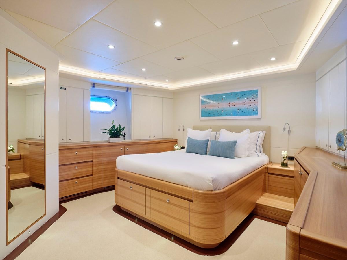 a bedroom with a large bed aboard 3D Yacht for Sale