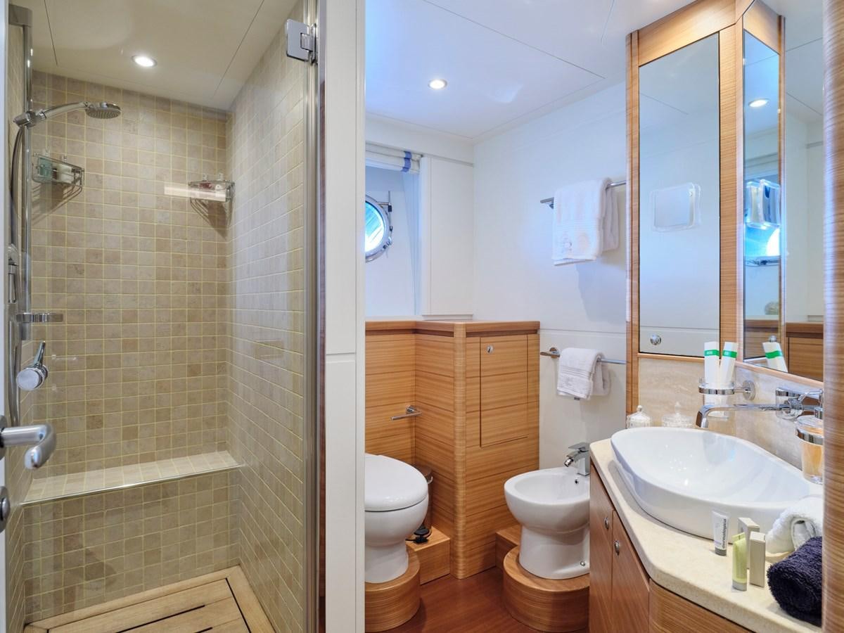 a bathroom with a sink toilet and a bathtub aboard 3D Yacht for Sale