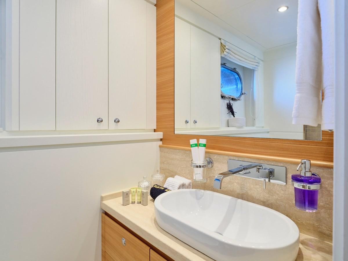 a bathroom with a large mirror aboard 3D Yacht for Sale