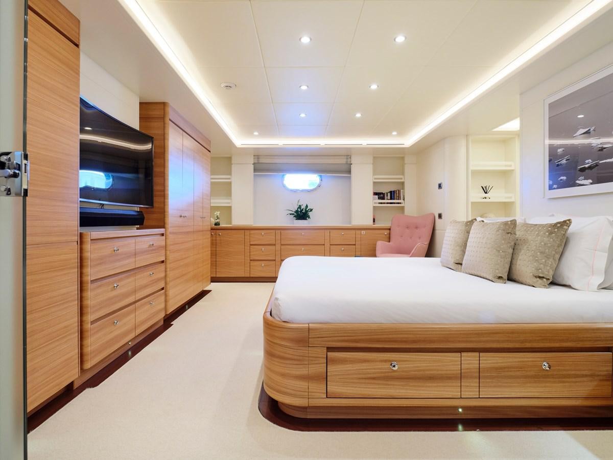 a bedroom with a bed and a tv aboard 3D Yacht for Sale