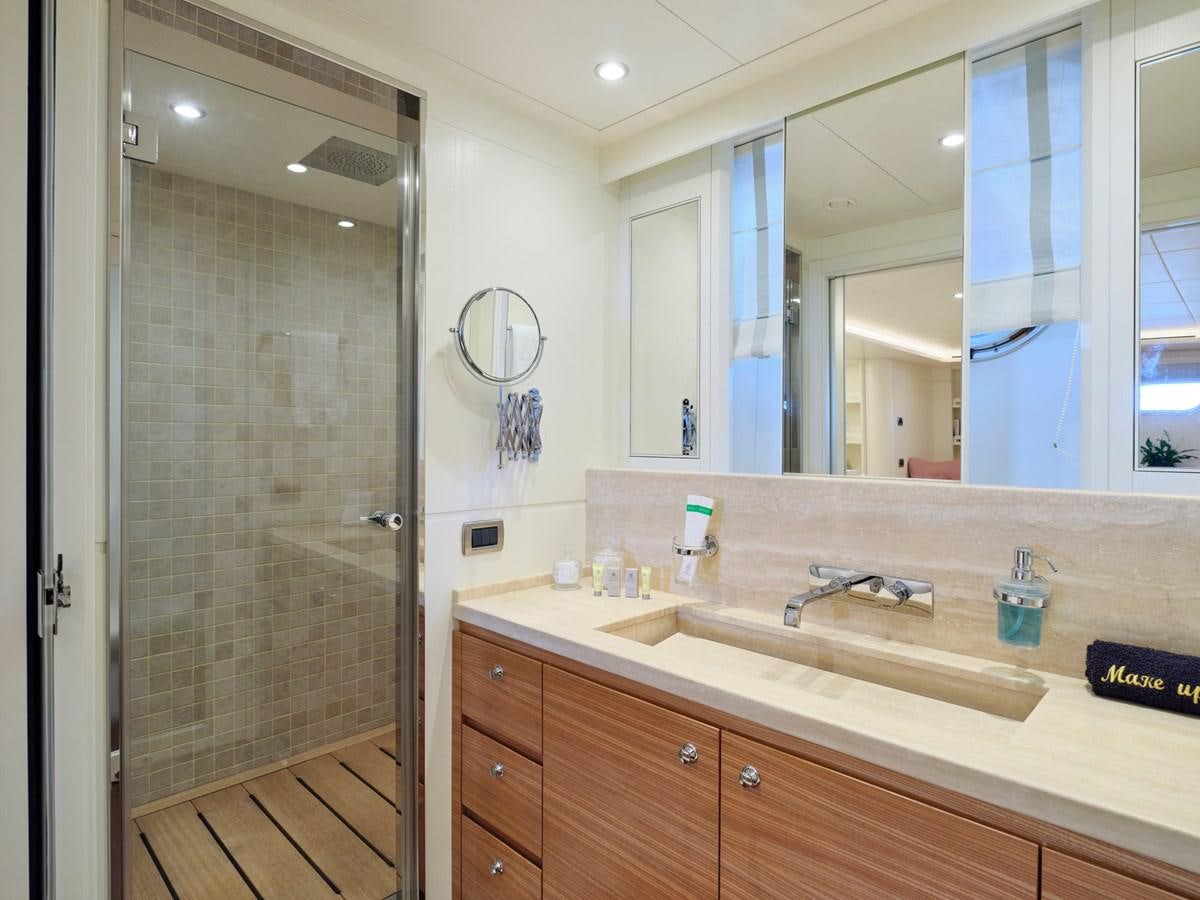 a bathroom with a large mirror aboard 3D Yacht for Sale