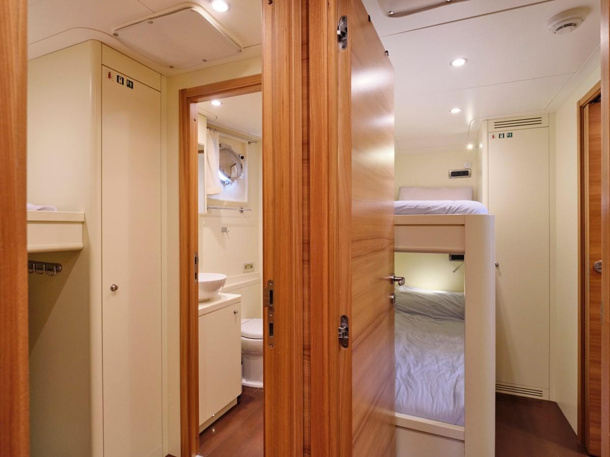 a bathroom with a wood door aboard 3D Yacht for Sale