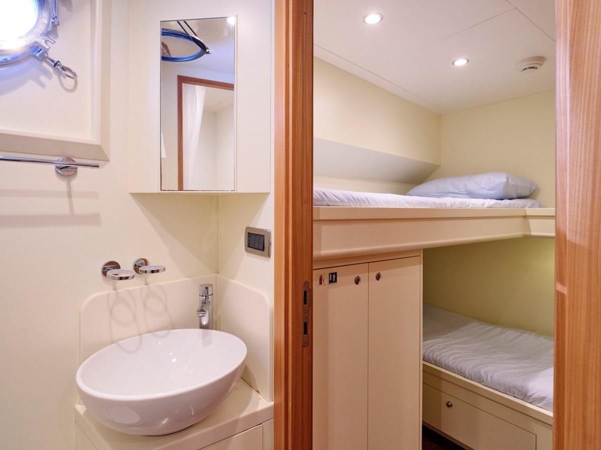 a bathroom with a sink and a mirror aboard 3D Yacht for Sale