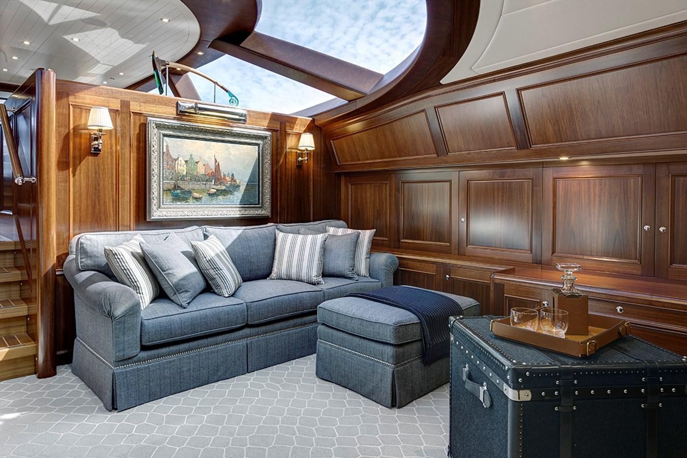 a living room with a large open ceiling aboard ENCORE Yacht for Sale