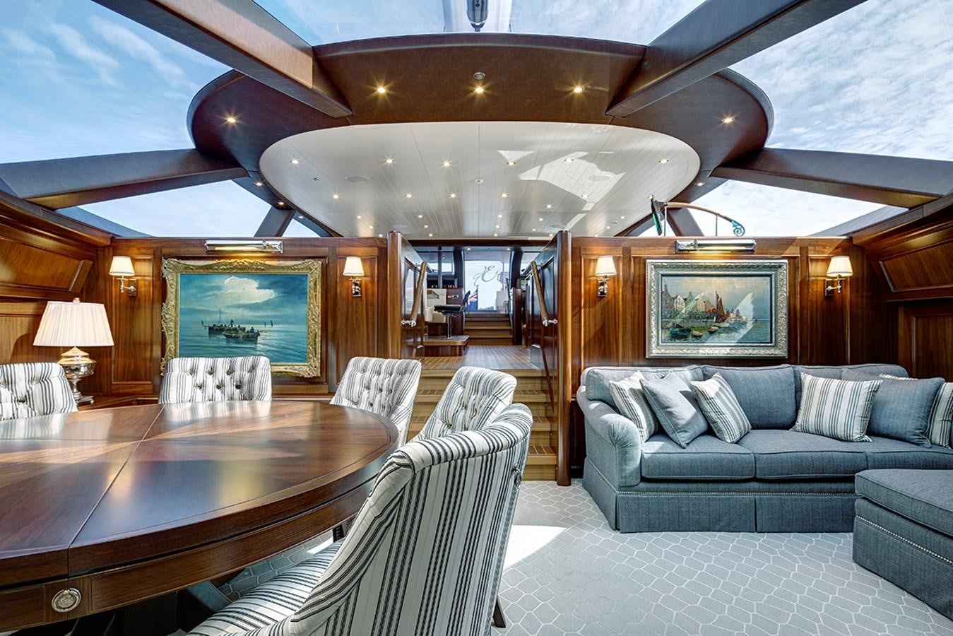a room with a couch and a table aboard ENCORE Yacht for Sale