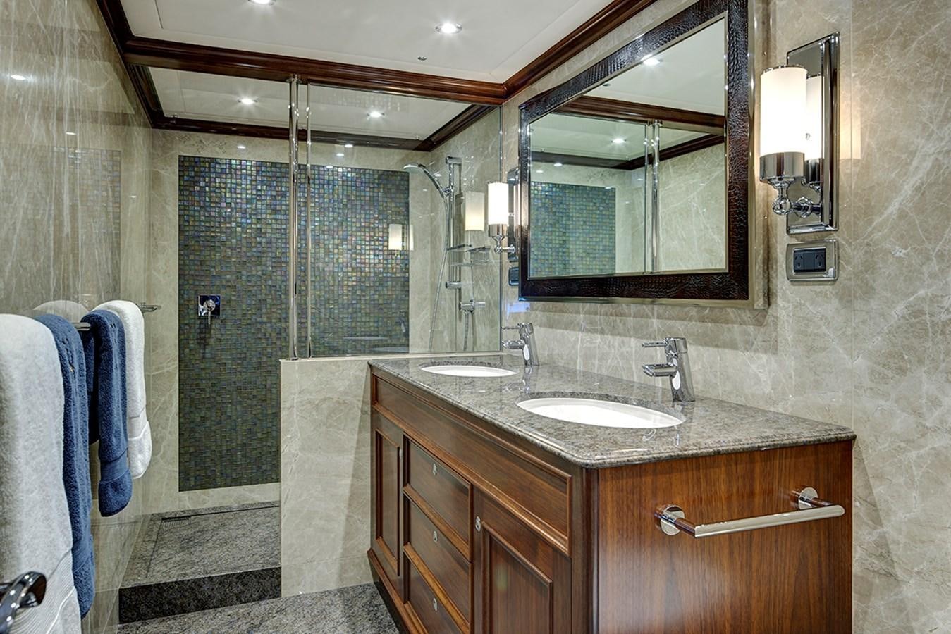 a bathroom with a marble counter top aboard ENCORE Yacht for Sale