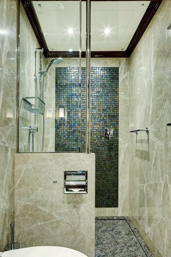 a bathroom with a glass shower aboard ENCORE Yacht for Sale