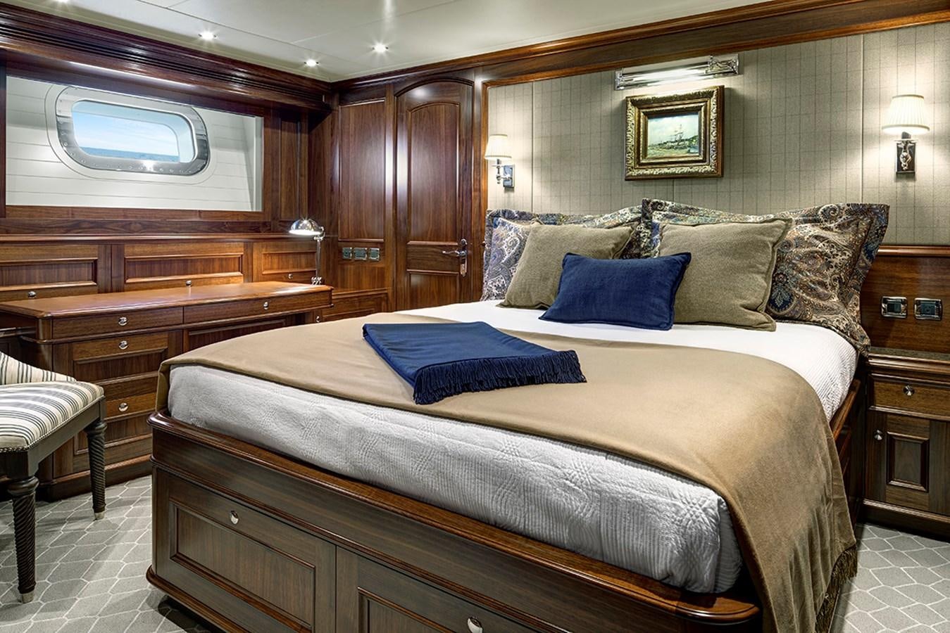 a large bed in a room aboard ENCORE Yacht for Sale