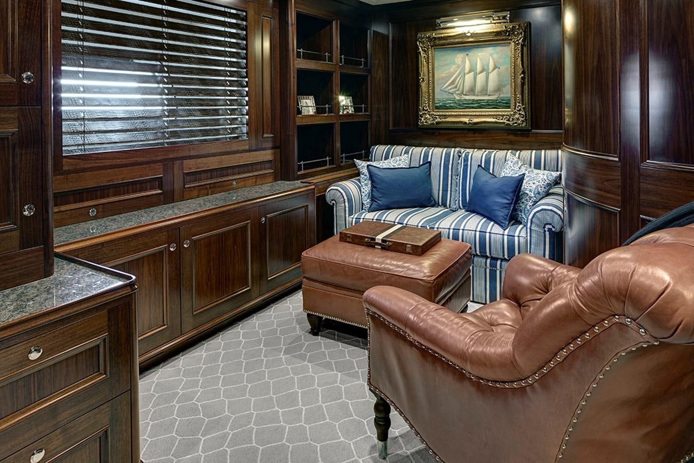 a living room with a couch and a chair aboard ENCORE Yacht for Sale