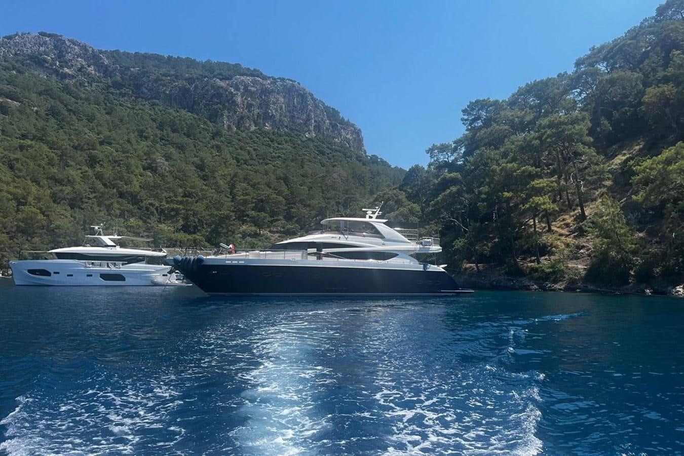 a couple of boats on the water aboard PRINCESS I Yacht for Sale