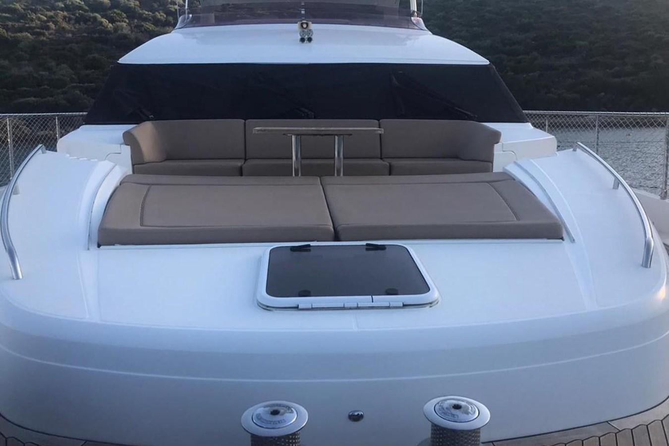 a white car with a black hood aboard PRINCESS I Yacht for Sale
