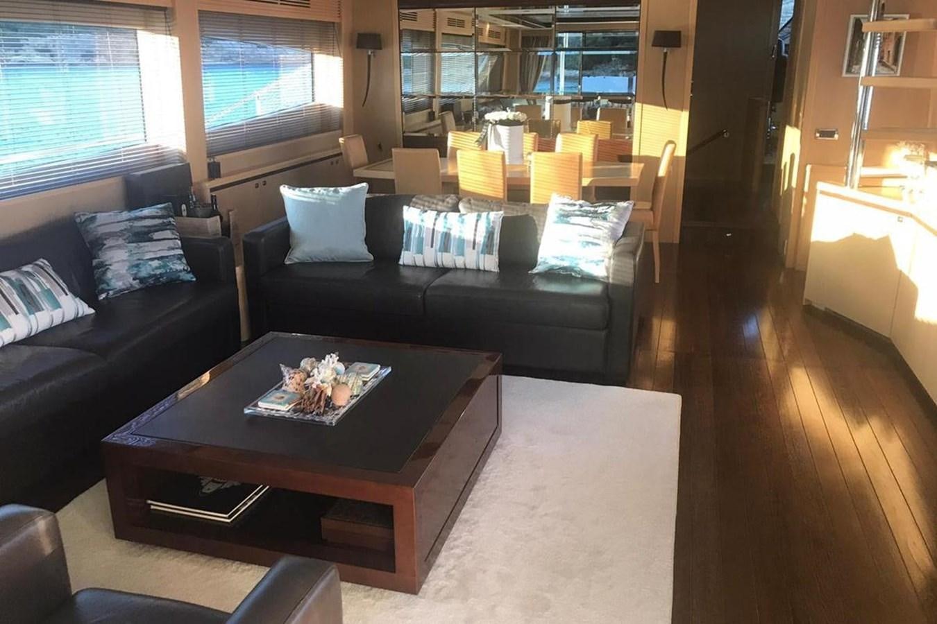 a living room with a couch and a coffee table aboard PRINCESS I Yacht for Sale