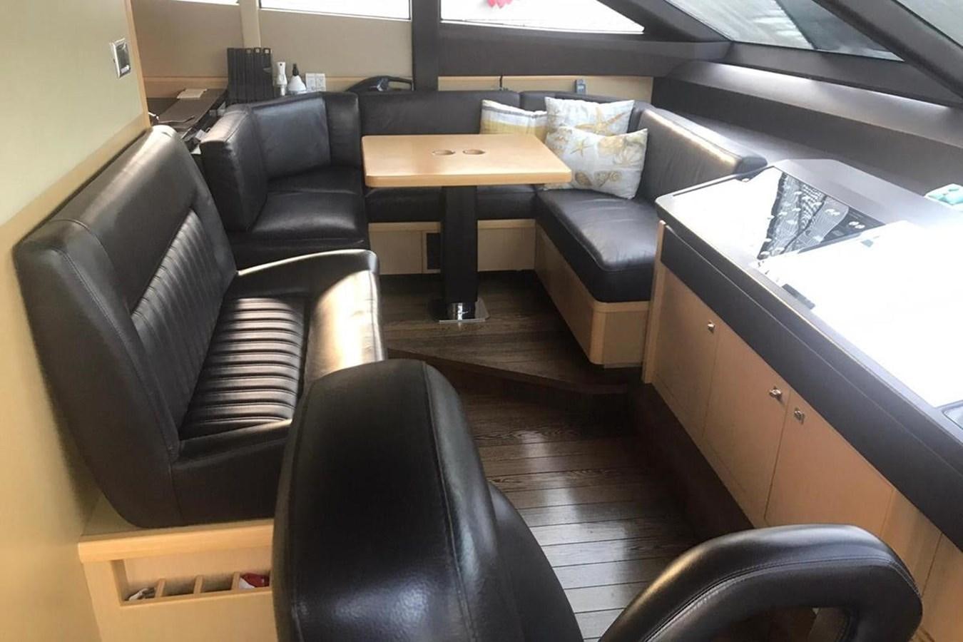 a room with a desk and chairs aboard PRINCESS I Yacht for Sale