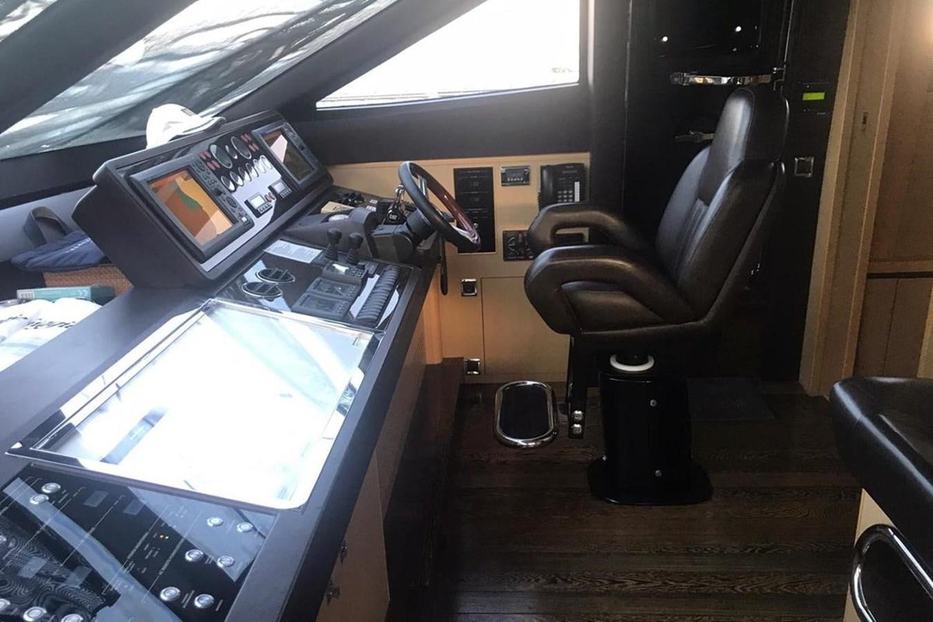 a computer on a desk aboard PRINCESS I Yacht for Sale