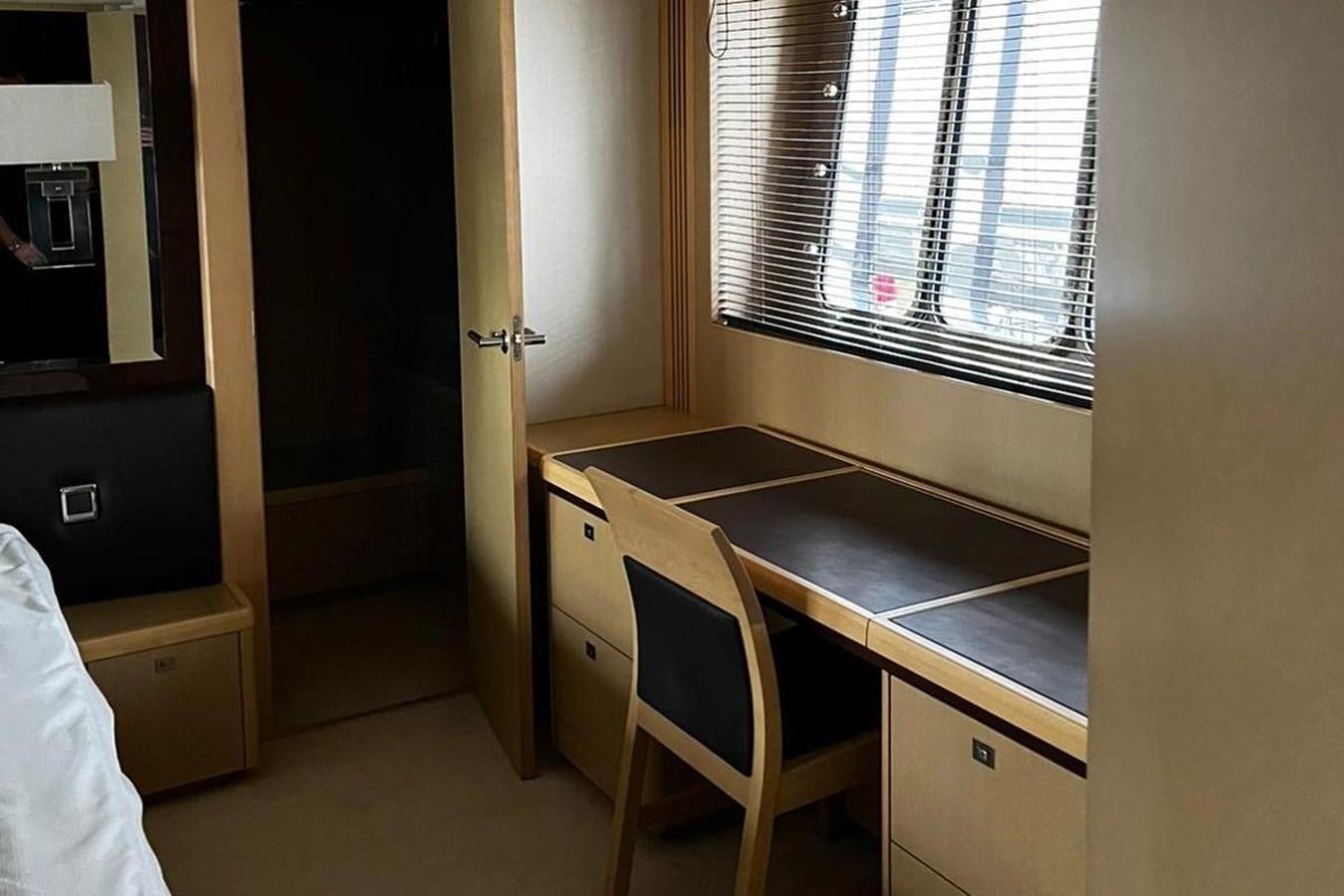 a room with a table and a window aboard PRINCESS I Yacht for Sale