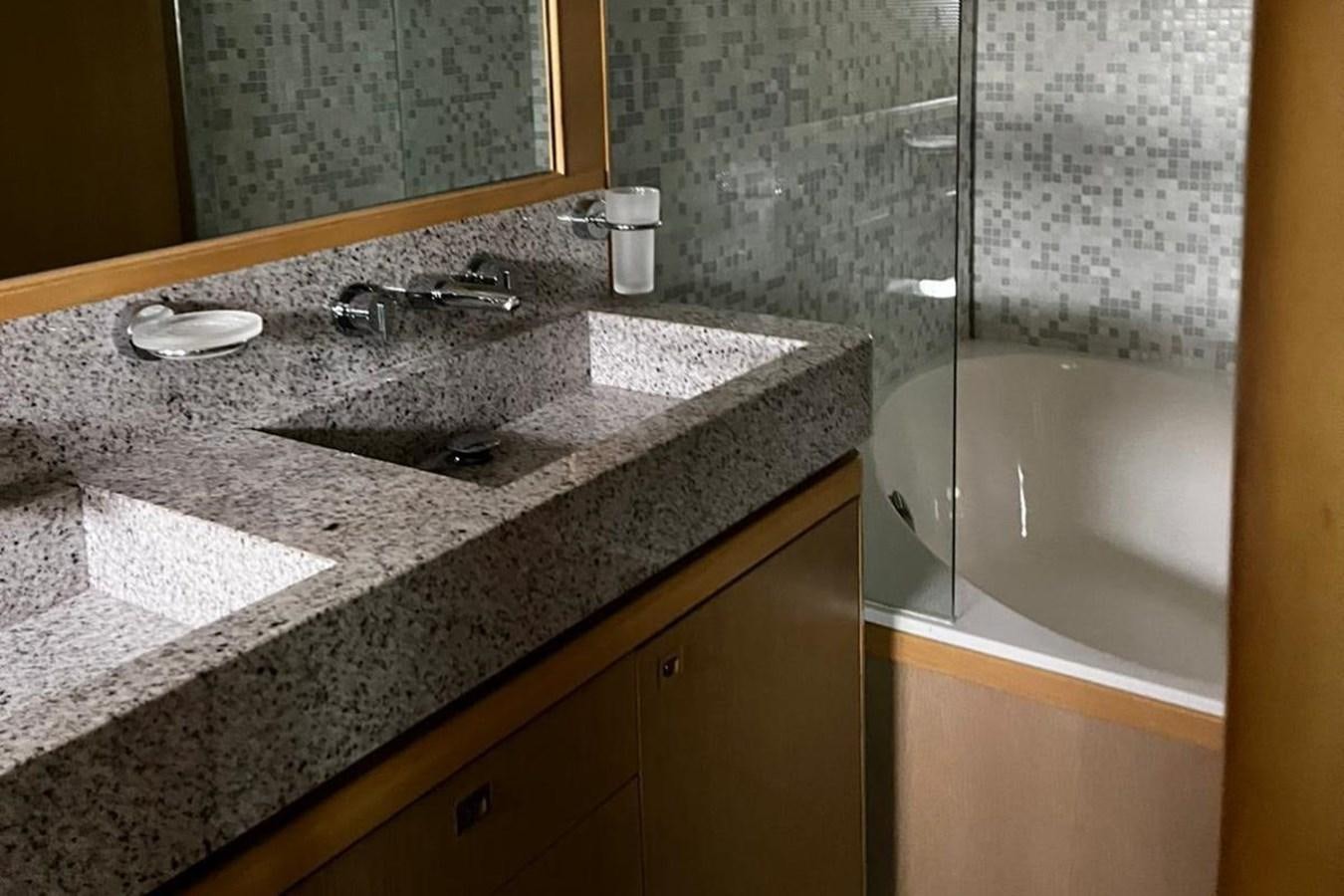 a bathroom with a marble counter top aboard PRINCESS I Yacht for Sale
